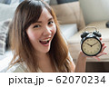 happy woman with punctual time; portrait of 62070234