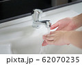 happy woman handwash; closeup hand portrait of 62070235