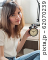 unhappy woman in trouble with late time; portrait 62070239
