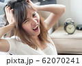 angry woman in trouble with late time; portrait of 62070241