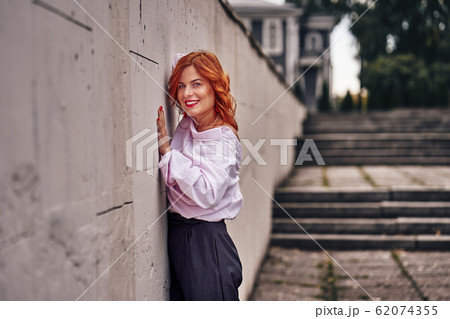 Portrait of a red-haired laughing middle-aged Portrait of a red-haired laughing middle-aged 62074355