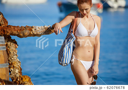WOman at the seaside. Adriatic, yachts in the WOman at the seaside. Adriatic, yachts in the 62076678