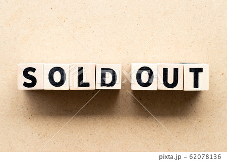 Letter block in word sold out on wood background 62078136