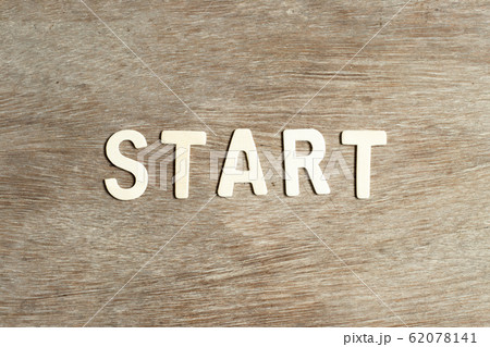 Alphabet letter in word start on wood background 62078141
