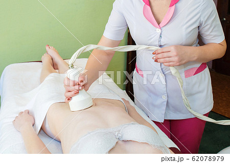 Body massage with cavitation. Young girl on 62078979