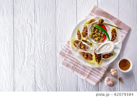 beef and chopped green olives Endive Boats 62079384