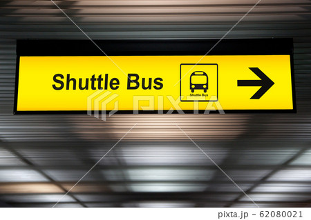 sign with arrow point to shuttle bus station at the airport for passenger who want to transfer from airport to the city. connecting transportation for convenient travel sign with arrow point to shuttle bus station at the airport for passenger who want to transfer from airport to the city. connecting transportation for convenient travel 62080021