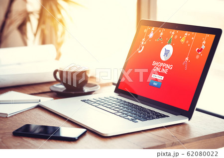 online shopping website on laptop screen for buy gift on seasonal and holiday for Christmas and new year gift. online shopping concept online shopping website on laptop screen for buy gift on seasonal and holiday for Christmas and new year gift. online shopping concept 62080022