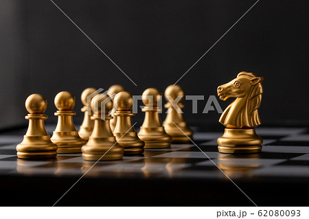 gold horse stood in front of the pawn 62080093