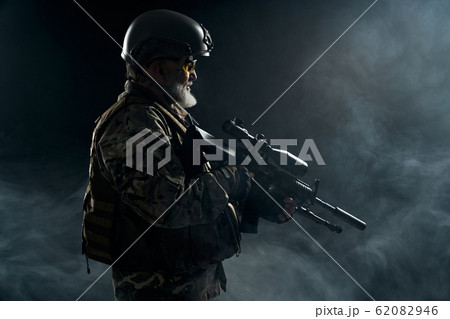 Old military officer holding sniper rifle. Old military officer holding sniper rifle. 62082946