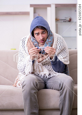 Young man suffering at home Young man suffering at home 62085584