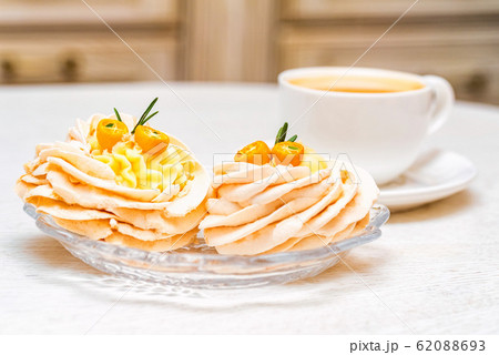 Meringue cake decorated with kumquat and coffee Meringue cake decorated with kumquat and coffee 62088693