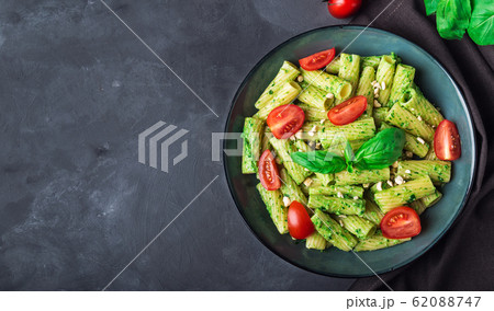 Homemade tortiglioni pasta with vegan pesto sauce Homemade tortiglioni pasta with vegan pesto sauce 62088747