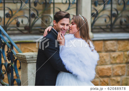 Close-up portraits of stylish newlyweds on the territory of country hotel Close-up portraits of stylish newlyweds on the territory of country hotel 62088978