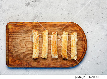 Pancakes with cottage cheese on old cutting wooden Pancakes with cottage cheese on old cutting wooden 62090388