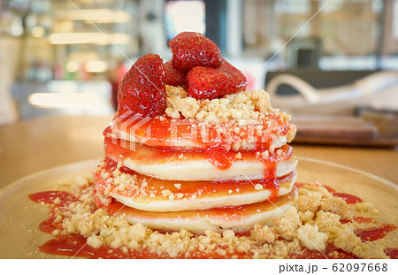 Pancakes strawberry fruit and sauce on wooden Pancakes strawberry fruit and sauce on wooden 62097668