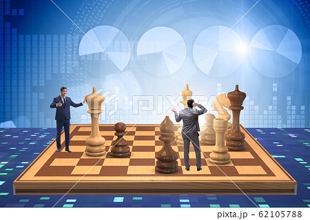 Businessman in large chess board in strategy concept Businessman in large chess board in strategy concept 62105788