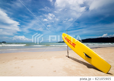 lifeguard surf rescue surfboard on the beach at rescue guard point with big wave ocean at background. helping , security and rescue concept lifeguard surf rescue surfboard on the beach at rescue guard point with big wave ocean at background. helping , security and rescue concept 62105905