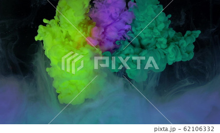 Multicolored composition from ink streams. ink streams from the rainbow spectrum float and mix in the center of the composition. Colorful abstract combination of acrylic rainbow colored black 62106332