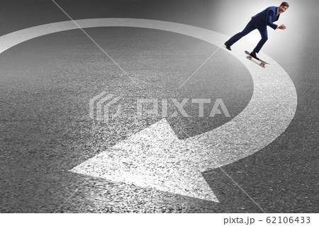 Businessman riding skateboard on financial graph 62106433