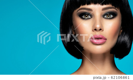 Glamour fashion model with black gloss make-up. 62106861