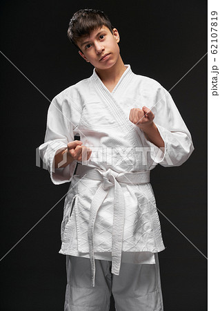 portrait of a teenager dressed in martial arts portrait of a teenager dressed in martial arts 62107819