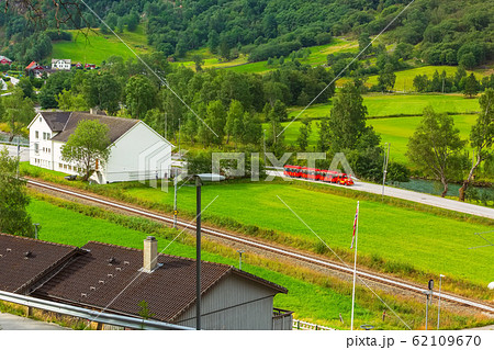 Flam, Norway red train tour in green valley Flam, Norway red train tour in green valley 62109670