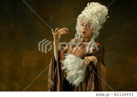 Medieval young woman in old-fashioned costume 62110435