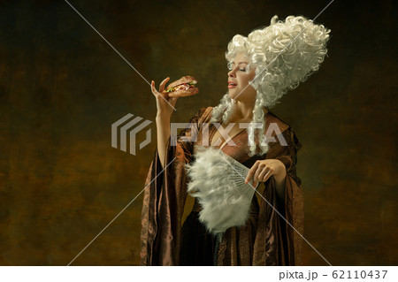 Medieval young woman in old-fashioned costume 62110437