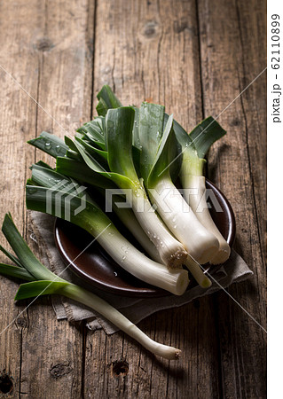 Leek on a plate on a wooden table 62110899