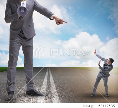 The bad angry boss shouting at employee with loudspeaker 62112535