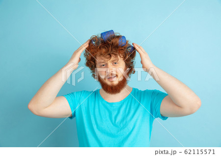 Portrait of young caucasian man in his beauty day and skin care routine Portrait of young caucasian man in his beauty day and skin care routine 62115571