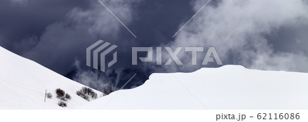 Off-piste slope and storm gray clouds Off-piste slope and storm gray clouds 62116086