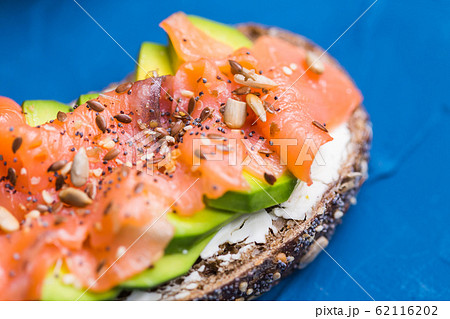 Sandwich with smoked salmon and cucumber. Concept for healthy nutrition. 62116202