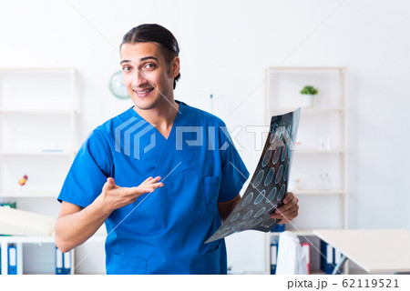 Young male doctor working in the clinic 62119521