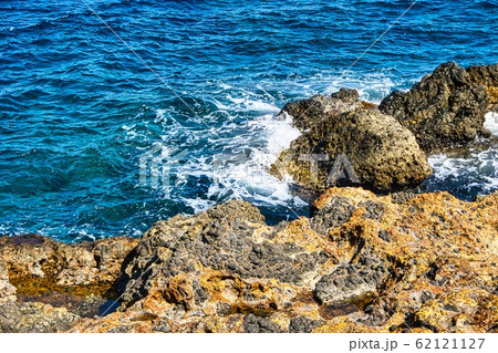 View on Rock on Nisyros island covered by orange View on Rock on Nisyros island covered by orange 62121127