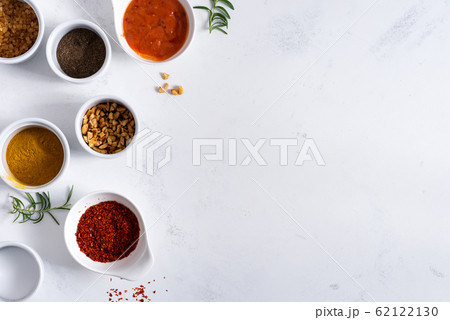 Set of different spices for sauces on stone background. Set of different spices for sauces on stone background. 62122130