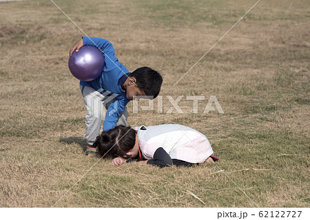 Little girl hiding her face. Little girl hiding her face. 62122727