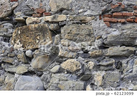 Very old wall from stones of various shapes and Very old wall from stones of various shapes and 62123099