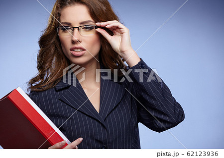 Business woman holding a folder Business woman holding a folder 62123936