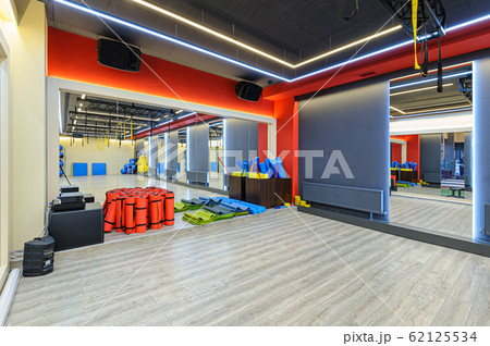 interior of modern gym with sports equipment interior of modern gym with sports equipment 62125534
