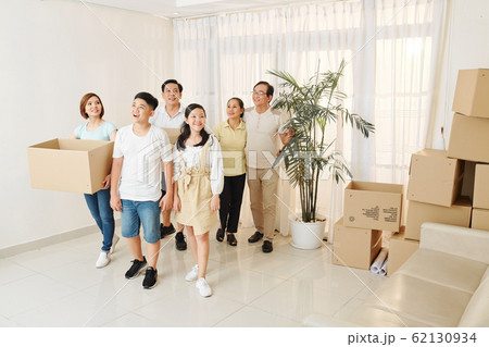 Family entering new house Family entering new house 62130934