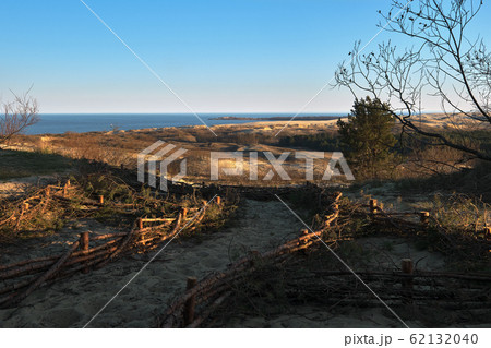 Sunset view of nordic dunes, early spring at Curonian spit, Nida, Klaipeda, Lithuania 62132040