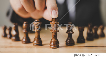 Panoramic image. Businessman with chess board game. Plan strategy and tactic concept 62132058