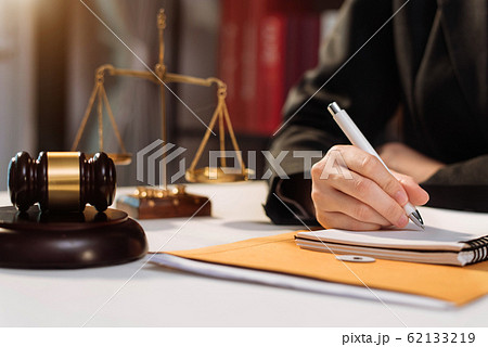 Lawyer singing in documents, filling court records, job responsibilities in office. Lawyer singing in documents, filling court records, job responsibilities in office. 62133219