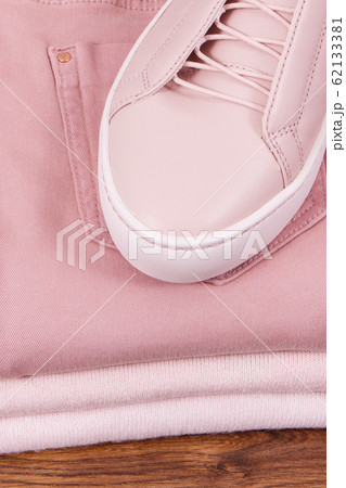 Leather shoes and stack of clothing for woman Leather shoes and stack of clothing for woman 62133381