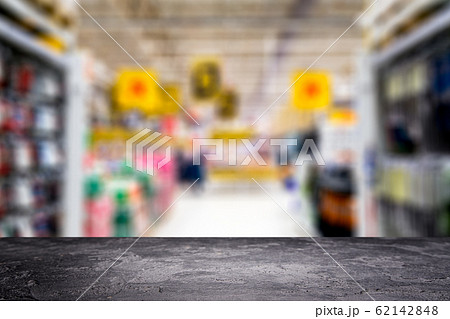 Black stone surface on blurry background in supermarket. 62142848