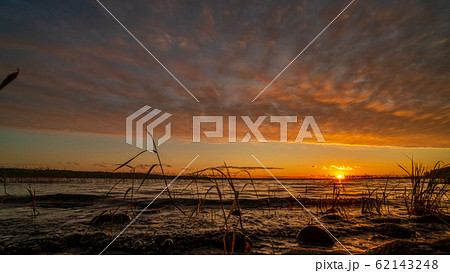 Beautiful lake in Karelia on sunset Beautiful lake in Karelia on sunset 62143248