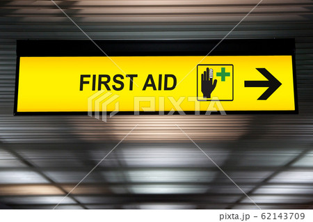 First aid medical station sign hanging from ceiling at the airport First aid medical station sign hanging from ceiling at the airport 62143709