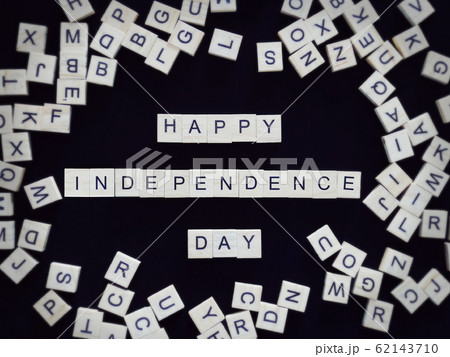 Happy Independence Day greeting card, alphabet letters word happy independence day on wooden pieces, isolated on black for background Happy Independence Day greeting card, alphabet letters word happy independence day on wooden pieces, isolated on black for background 62143710